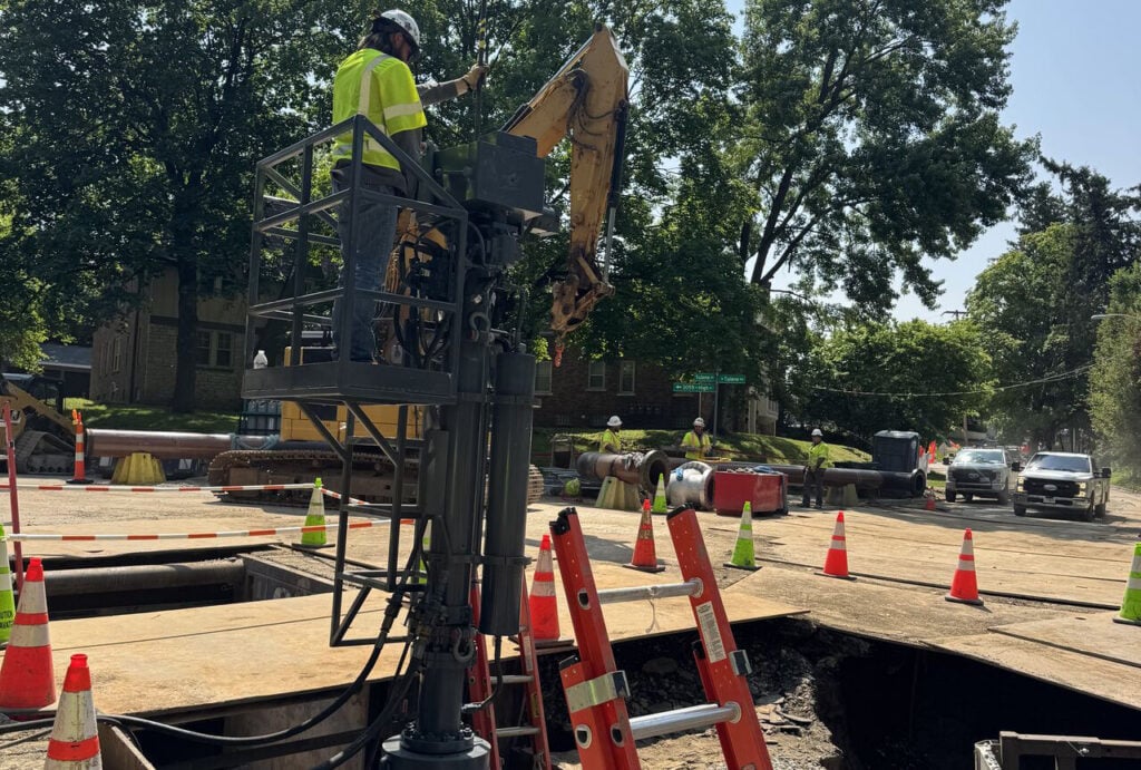 Technicians perform a 20-inch double line stop in a residential neighborhood as part of critical infrastructure maintenance, ensuring uninterrupted utility service during pipeline modifications.