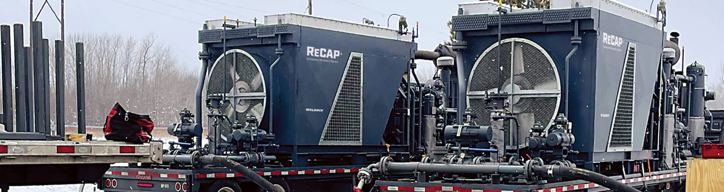 Two trailer mounted ReCAP LP units on a job site in a snowy landscape